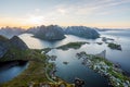 From top of the famous Reinebringen overlooking the city of Reine in Lofoten,Norway during the midnight sun. Royalty Free Stock Photo