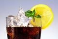 Top of a glass of cola or coke with ice cubes, lemon slice and p Royalty Free Stock Photo