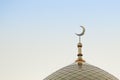 The top of the golden minaret with the symbol of Islam is the growing moon of the golden crescent moon. Right in the frame. Royalty Free Stock Photo