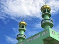 Top of green mosque at Pran buri, Thailand with cloudy sky. Royalty Free Stock Photo