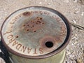 Top of Green Rusty Old Oil Drum Barrel in Desert Royalty Free Stock Photo