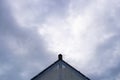 Triangular roof on the sky background