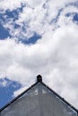 Triangular roof on the sky background