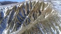 Top of High mountains, covered by snow. Shot. Top view of the snowy hill. Beautiful landscape Royalty Free Stock Photo