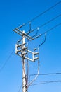 Top of a high voltage power pole, electrical wires