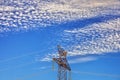 Top of high voltage pylon with nice sky with many clouds Royalty Free Stock Photo