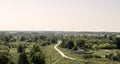 From the top of the hill overlooking the old village and the road leaving into the distance