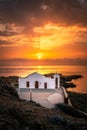 view from a rock on the typical greek church Chapel of Agios Nikolaos on zakyntos, sunrise at the sea Royalty Free Stock Photo