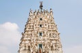 Top of Hindu temple with many sculptures of gods