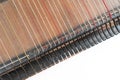 Top horizontal studio shot of vintage, old wooden zither isolated on white background. Detail of zither strings creates