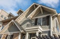 Top of a house with nice windows. Dormer and a blue sky. Real Estate Exterior Front House in a residential neighborhood Royalty Free Stock Photo