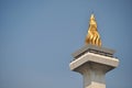 the top of the Jakarta National Monument, where you can see a large piece of gold