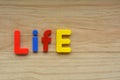 Top lay of the word Life on a wooden background Royalty Free Stock Photo