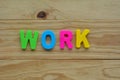 Top lay of the word Work on a wooden background Royalty Free Stock Photo