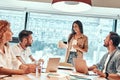 Top manager making presentation for business team in office