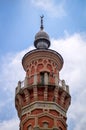 Top of the minaret of the Sunni Mukhtarov Mosque in Vladikavkaz city, North Ossetia Alania, Russia in front of bright