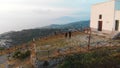 Top of the mountain, couple of tourists are walking, coastline of the Sorrento. Sky and sea. Sunset time. High view point. Vacatio