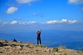 Girl on top of a high mountain