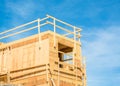 Top of new building under construction on blue sky background. Royalty Free Stock Photo