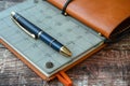 Top notch image of calendar page, pen, and pocket planner for efficient organization and planning Royalty Free Stock Photo