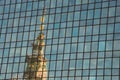 Top of the Palace of culture and science reflected in a glass facade. Warsaw