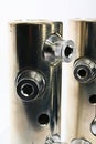 Top part of large diameter electric cable connection tubes with allen key screws, made of stainless steel Royalty Free Stock Photo