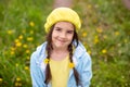 Top Portrait of a charming little girl with two pigtails with woven dandelions Royalty Free Stock Photo