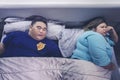 Fat woman awakened because of her husbands snoring