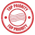 TOP PRIORITY text written on red round postal stamp sign Royalty Free Stock Photo