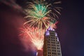 Top of purple Lincoln Tower with dazzling Fourth of July fireworks display in Fort Wayne Royalty Free Stock Photo