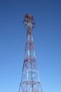 Top of the red and white electricity pylon Royalty Free Stock Photo