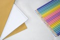 Top right view, Group of color pencild laying in row striaght line made by pencil tips on white and paper background, close up, Royalty Free Stock Photo