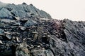 The top of a rocky mountain range. Gray flat stones