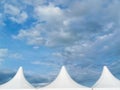 Top Roof of a circus tent agains cloudy blue sky Royalty Free Stock Photo