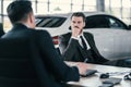 Top sales manager and customer at dealership showroom Royalty Free Stock Photo