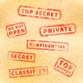 Top secret red vintage grunge stamp collection on old yellow paper Royalty Free Stock Photo