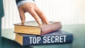 Top Secret text concept write on book on wooden background Royalty Free Stock Photo