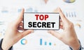Top secret - text on smartphone, Concept of Top Secret