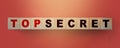 Top Secret words on wooden building cubes blocks. Business, education, Marketing or scandal reveal concept