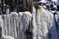 Waterfall Surrounded by Icicles in the Winter