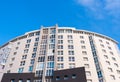 Top of semicircular modern residential house against blue sky. Royalty Free Stock Photo