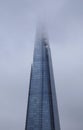 The top of The Shard in London, UK in low cloud on an overcast, rainy Winter day. Jan 20 2018 Royalty Free Stock Photo