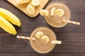 Top shot banana smoothie on wooden background Royalty Free Stock Photo