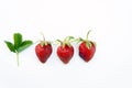 Top shot, close up of fresh strawberries, green leaves on white background isolated, selective focus, space for text, healthy Royalty Free Stock Photo