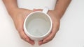 Top shot of female hand holding glass of water  on white Royalty Free Stock Photo