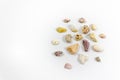 Top shot of several circular right side positioned colorful stones that collected from beach on white background Royalty Free Stock Photo