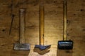 Top shot of three different old hammers on the wooden background Royalty Free Stock Photo