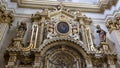 Top of a side Altar of the Duomo Cathedral featuring a statue of our Lady of the Assumption in Lecce, Italy