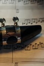 The top side of a clarinet on music Royalty Free Stock Photo