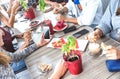 Top side view of friends drinking cappuccino at coffee shop restaurant - People having fun together eating and using mobile phone Royalty Free Stock Photo